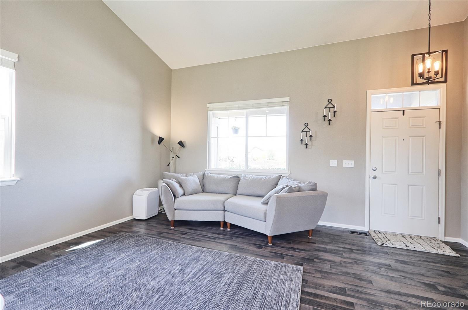 8376 Brandywine Avenue Frederick, CO 80504 - Photo 5 of 31 a living room with furniture and a window