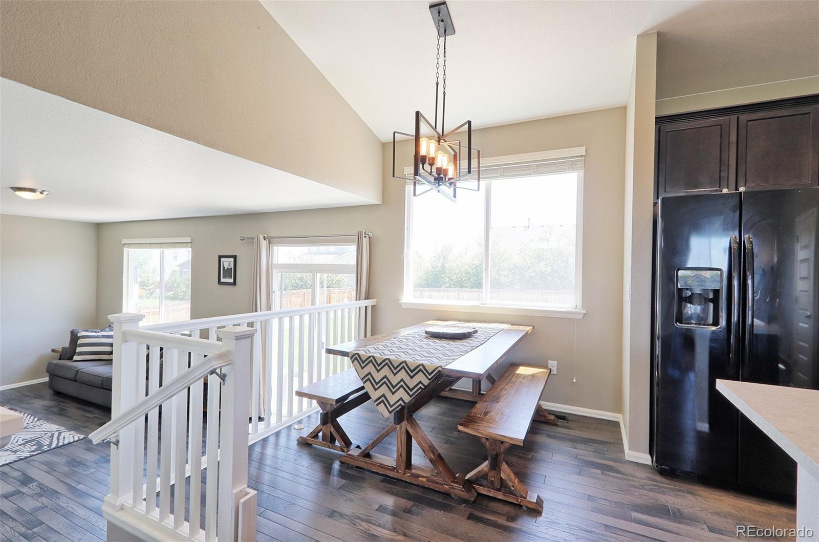 8376 Brandywine Avenue Frederick, CO 80504 - Photo 9 of 31 a workspace with wooden floor and windows