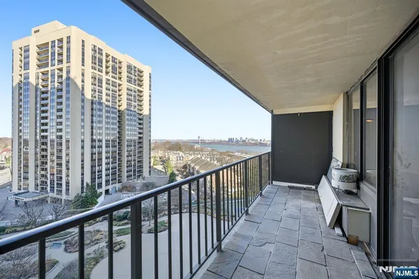 a view of a balcony with wooden floor