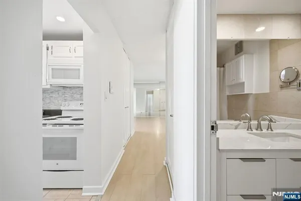 a en suite bathroom with a sink a mirror and a shower
