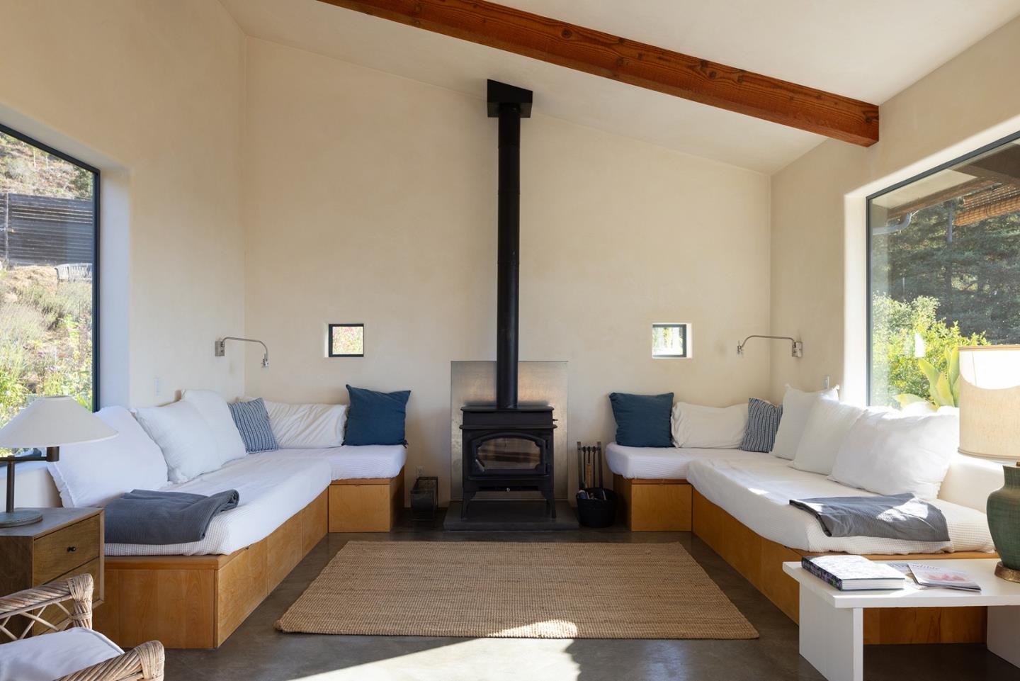 47320 Highway 1 Big Sur, CA 93920 - Photo 45 of 73 a living room with furniture and a large window