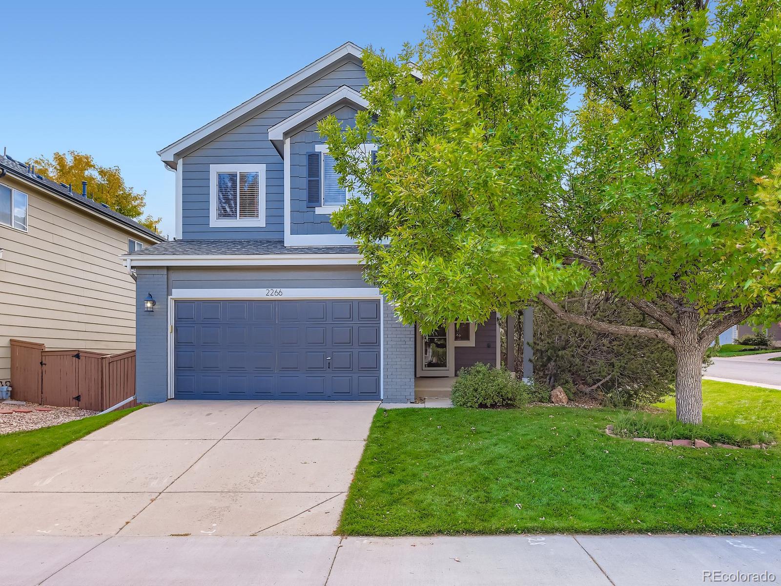 2266 West Ashwood Place Highlands Ranch, CO 80129 - Photo 2 of 48 a view of a backyard of the house