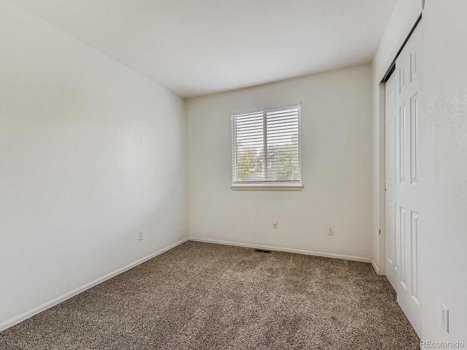 2266 West Ashwood Place Highlands Ranch, CO 80129 - Photo 25 of 48 an empty room with a window