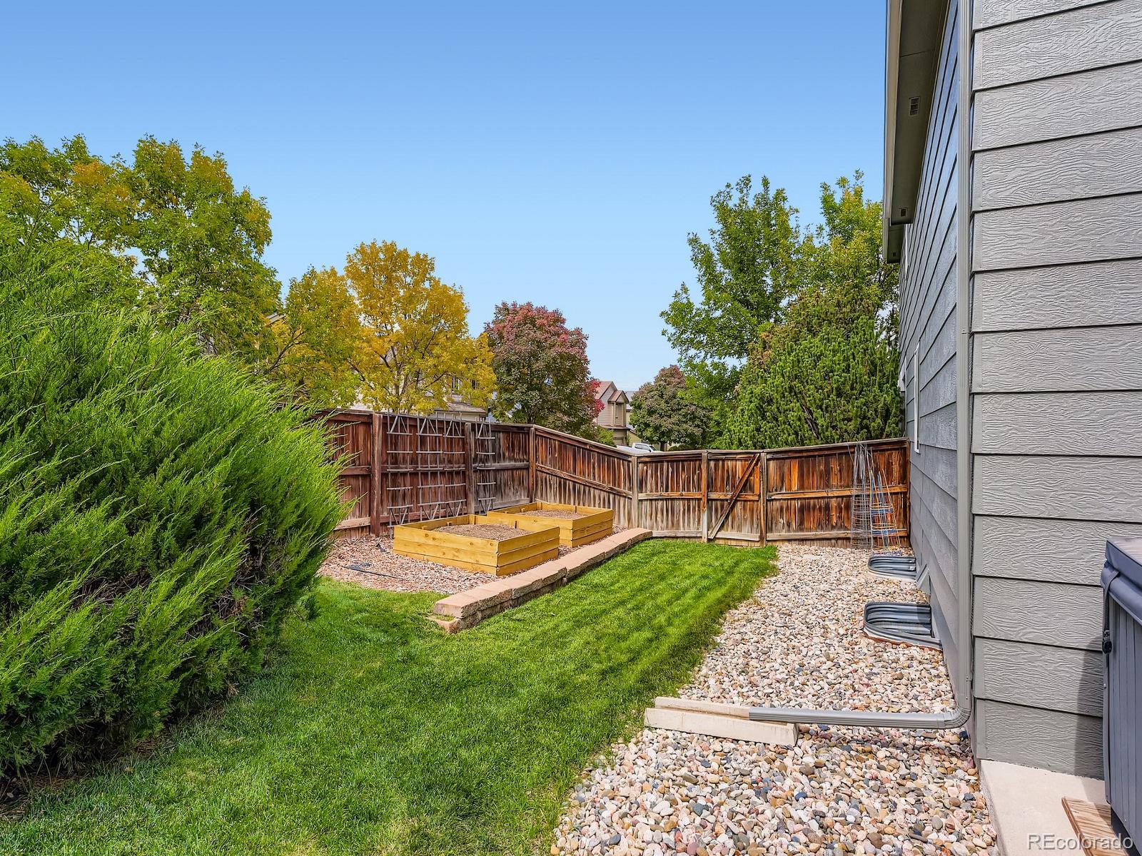 2266 West Ashwood Place Highlands Ranch, CO 80129 - Photo 32 of 48 a view of a backyard with a small cabin