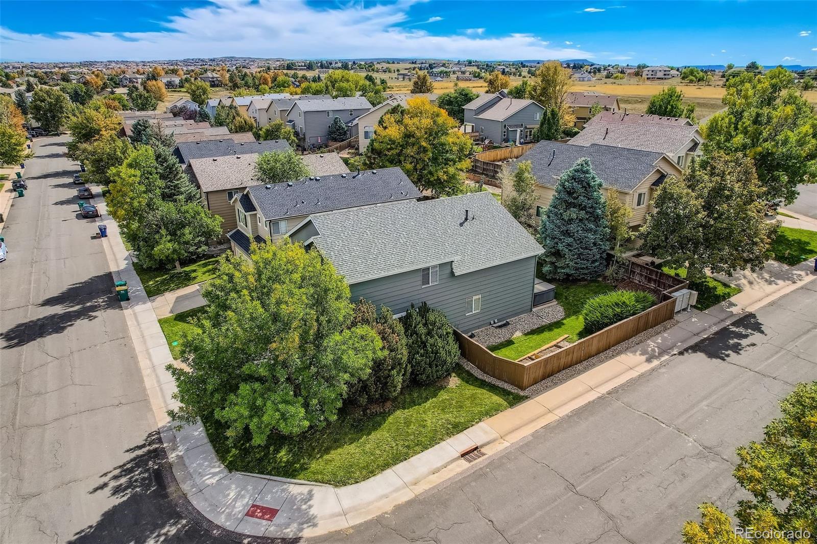 2266 West Ashwood Place Highlands Ranch, CO 80129 - Photo 34 of 48 an aerial view of a house with a garden