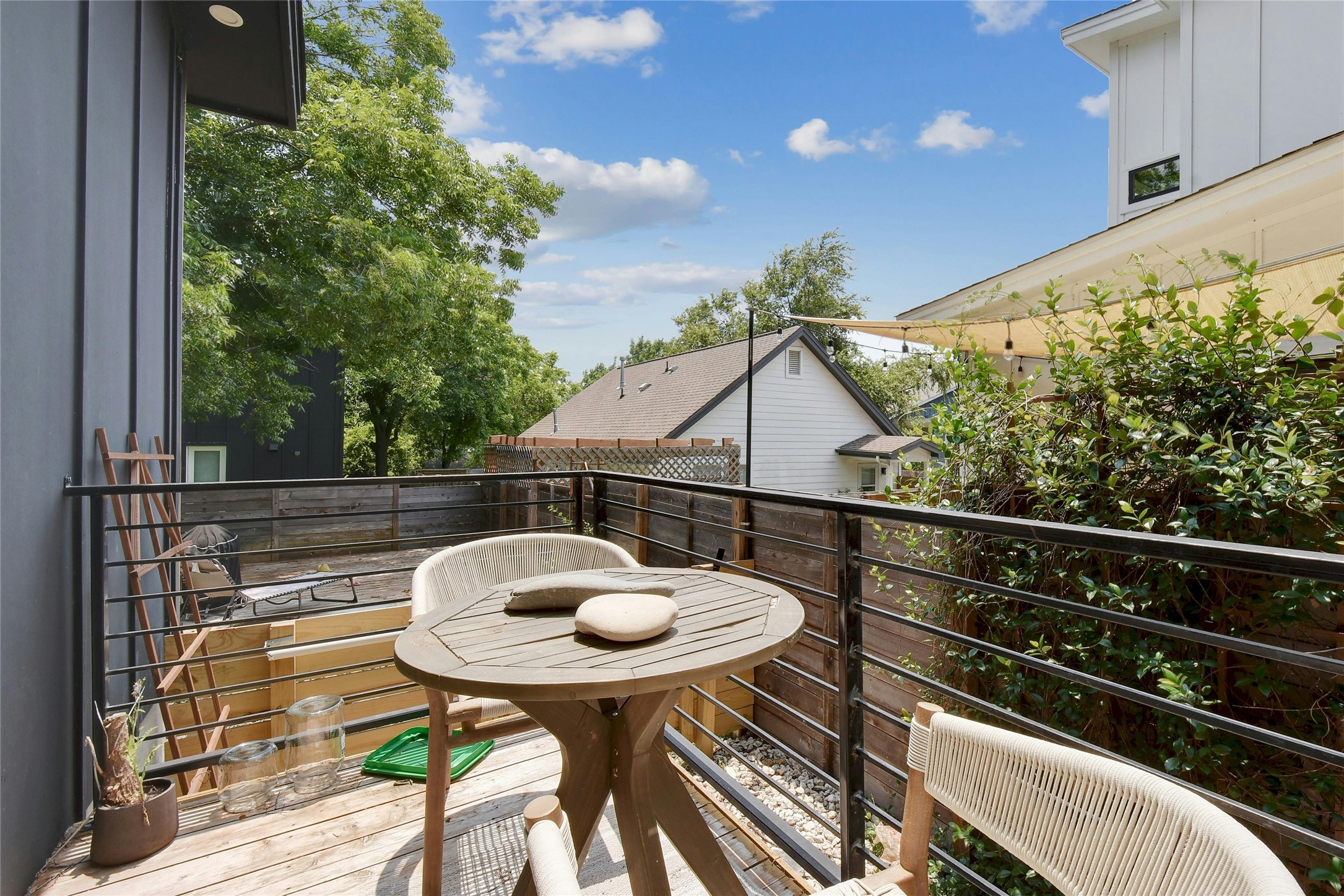 4606 Ledesma Road, Unit 2 Austin, TX 78721 - Photo 25 of 33 A cozy, sun-dappled balcony awaits, perfect for serene outdoor relaxation.