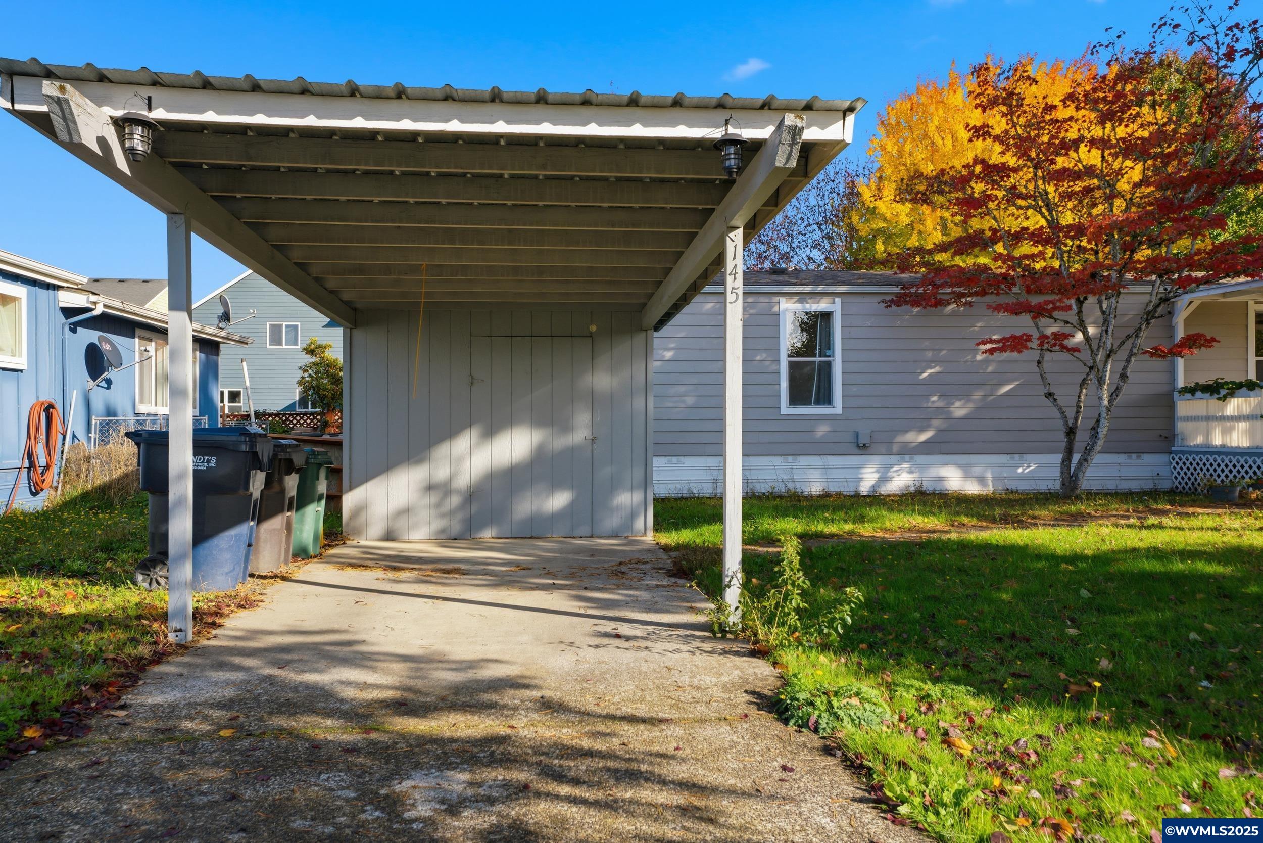 277 Edwards Road, Unit 145 Monmouth, OR 97361 - Photo 36 of 47 a front view of a house with a yard
