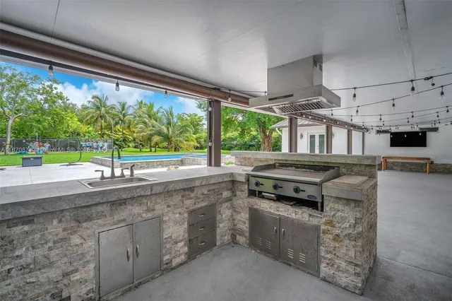 a kitchen with a stove and a sink