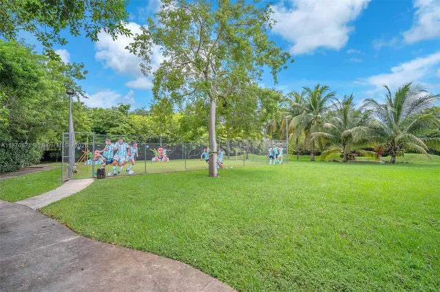 a view of a park with large trees