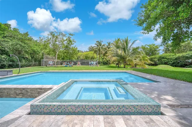 a view of a swimming pool with an outdoor space