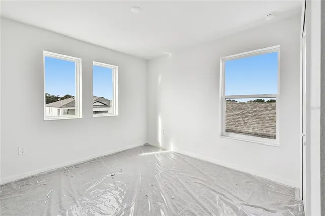 an empty room with windows