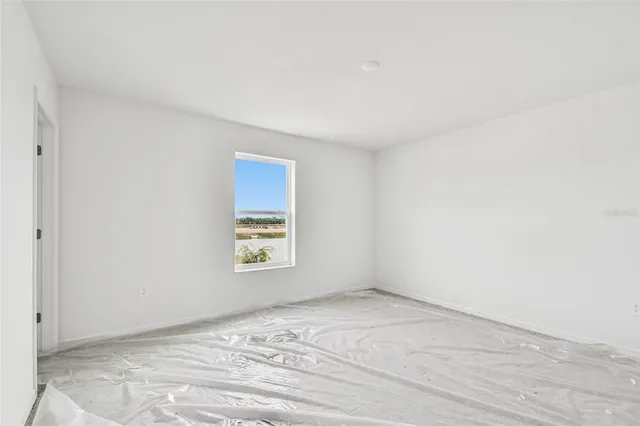 a view of an empty room and window