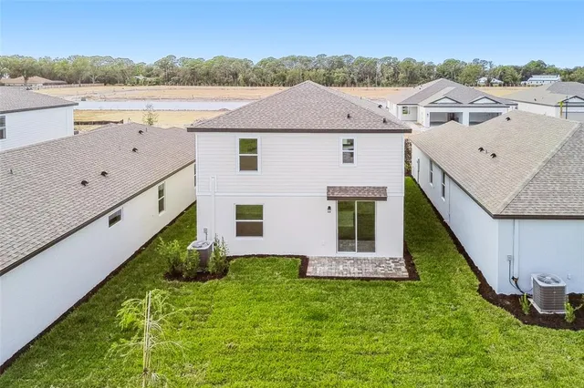 a aerial view of a house with a yard