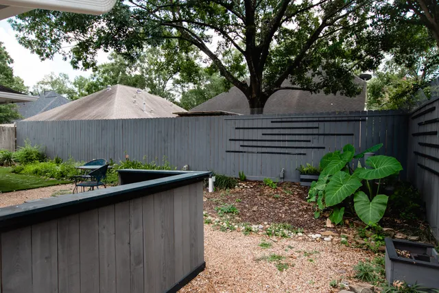 a view of a room with wooden floor and outdoor space