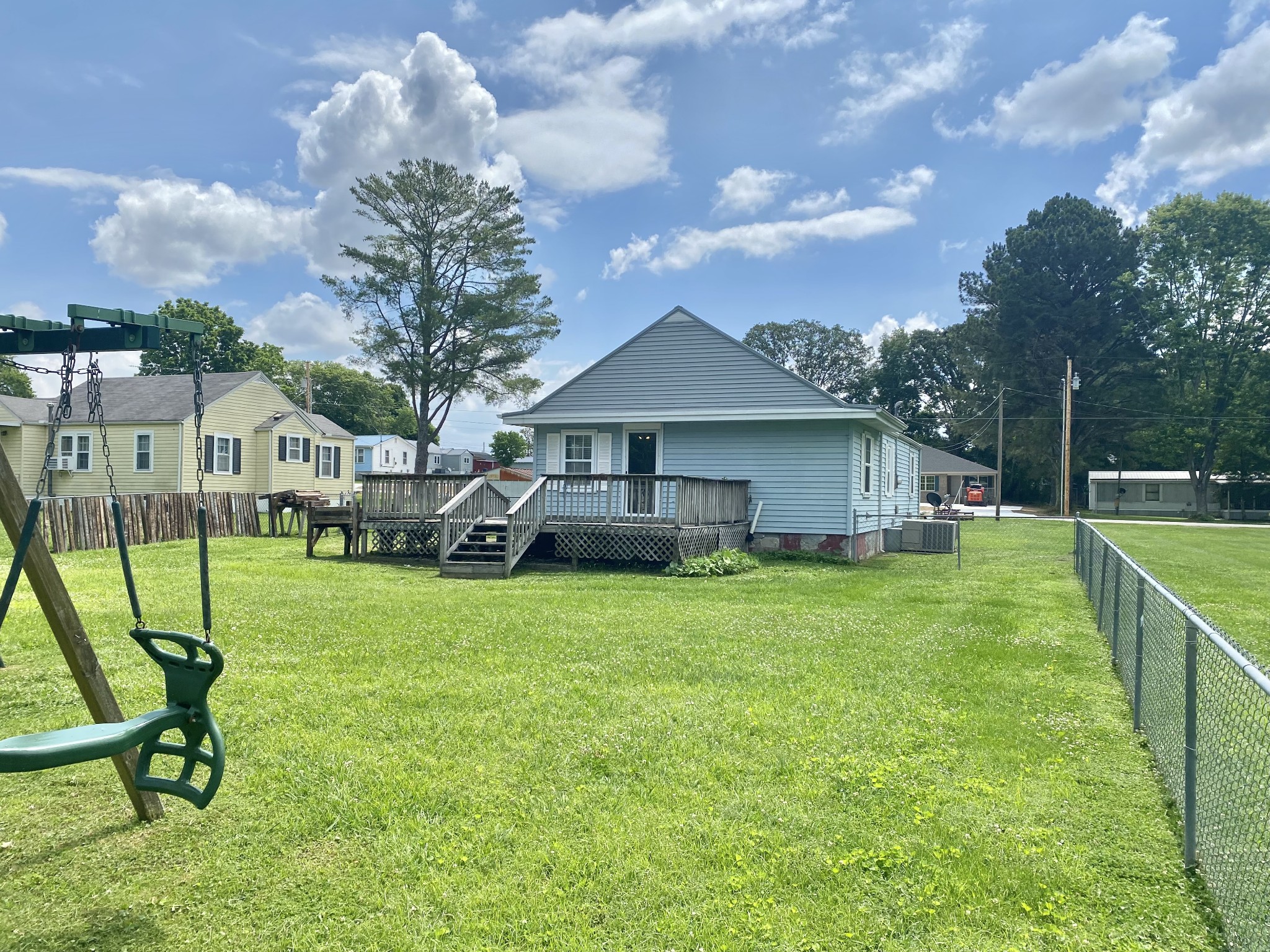 271 Hunt Street Manchester, TN 37355 - Photo 19 of 21 a front view of a house with a garden and trees