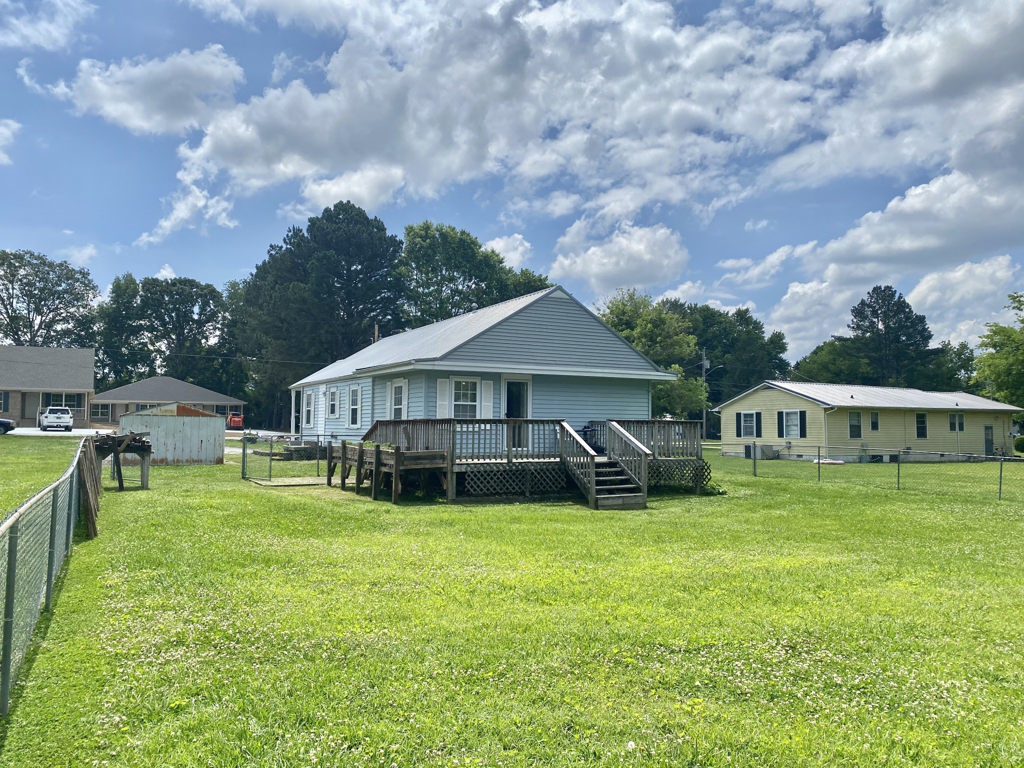 271 Hunt Street Manchester, TN 37355 - Photo 20 of 21 a view of a house with a big yard and large trees