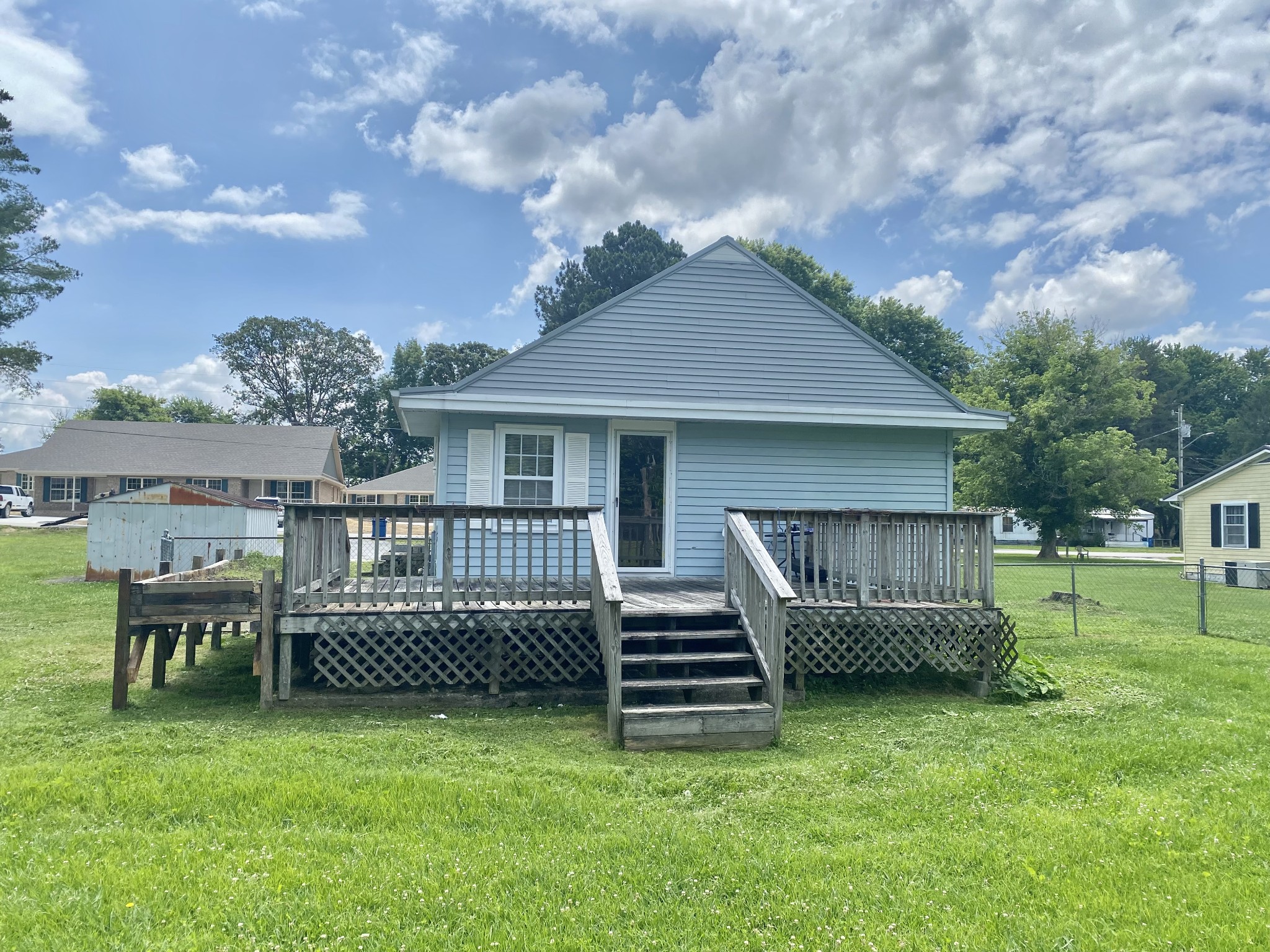 271 Hunt Street Manchester, TN 37355 - Photo 21 of 21 a backyard of a house with table and chairs