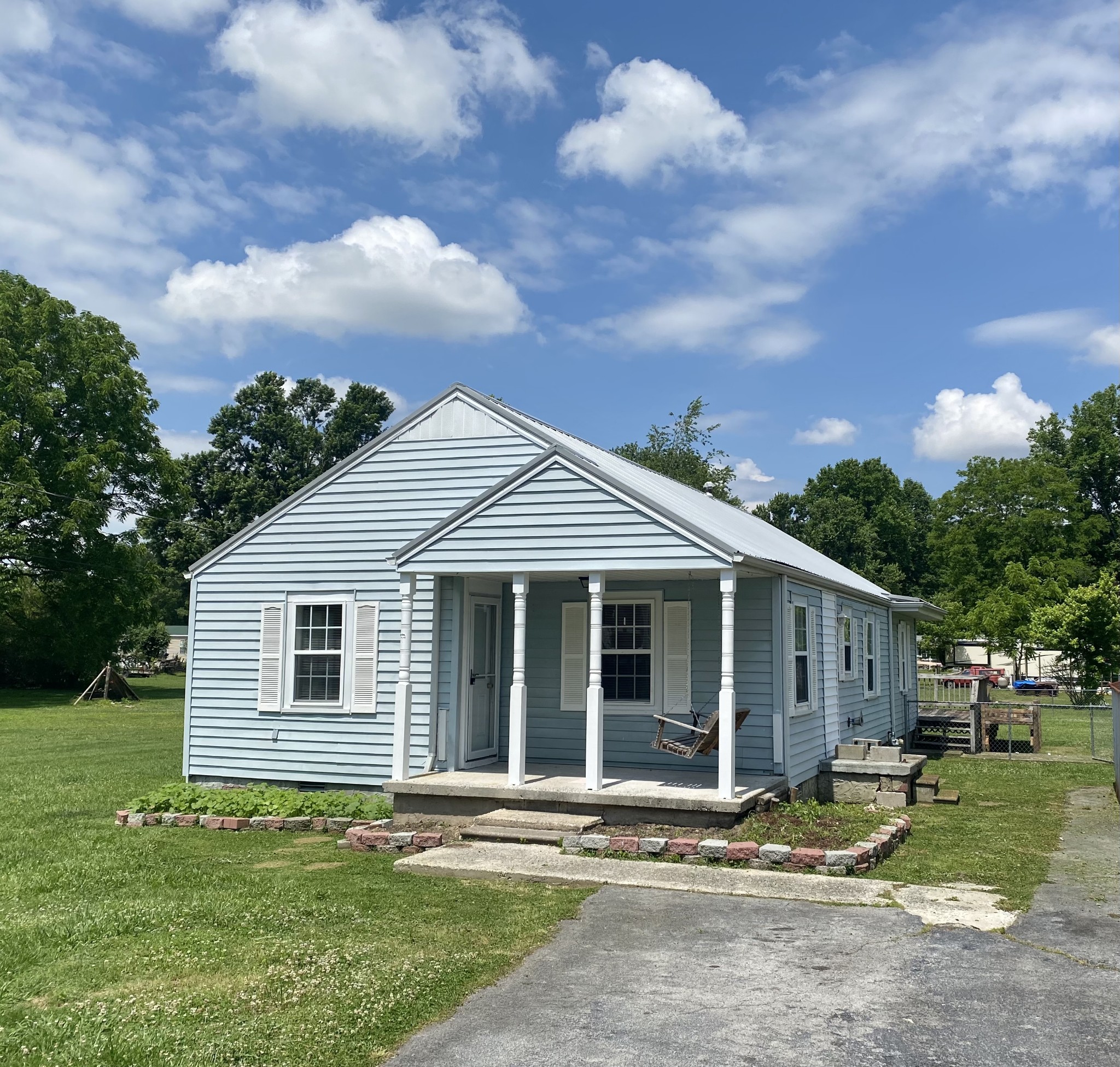 271 Hunt Street Manchester, TN 37355 - Photo 3 of 21 a view of a house with a yard and fence