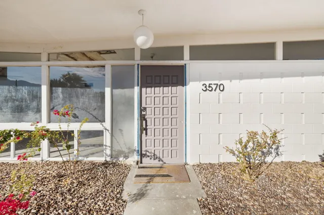 a view of a living room and a balcony