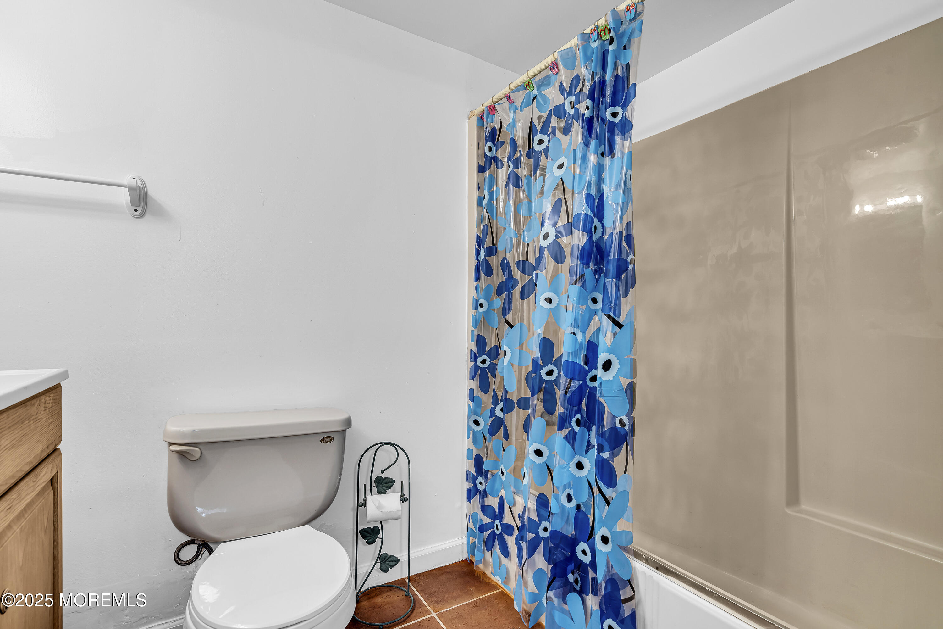 444 Cook Road Jackson, NJ 08527 - Photo 26 of 71 a bathroom with a toilet and a shower curtain