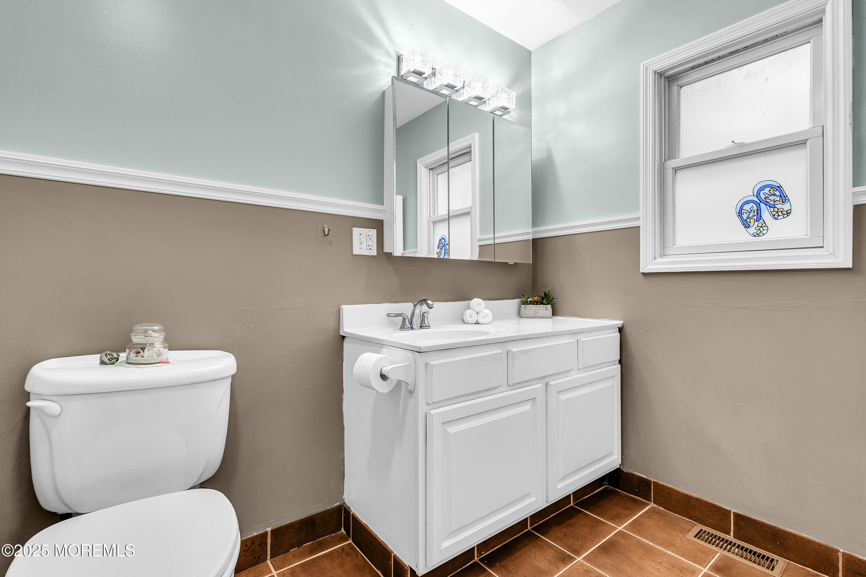 444 Cook Road Jackson, NJ 08527 - Photo 32 of 71 a bathroom with a toilet sink and mirror