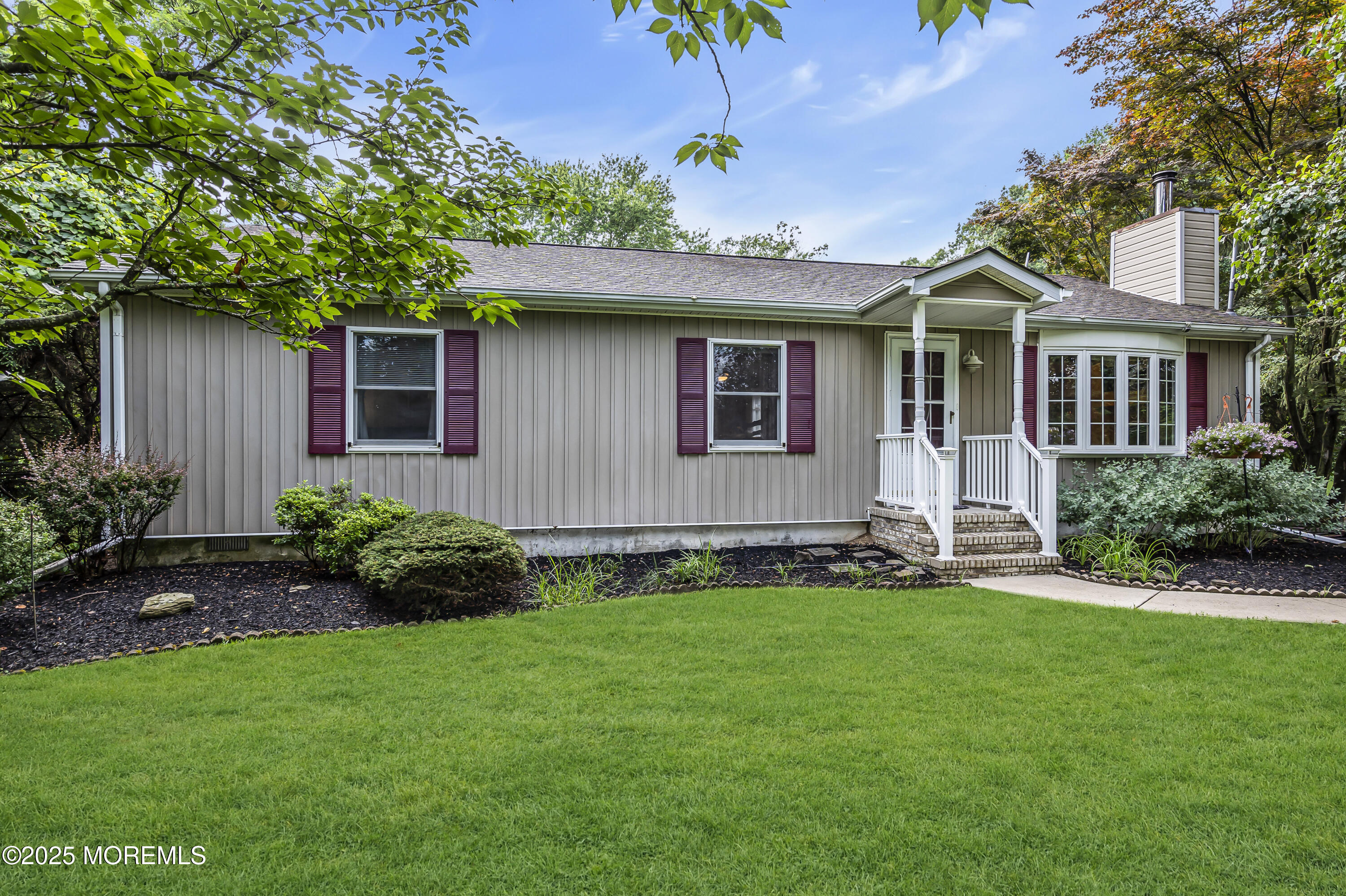 444 Cook Road Jackson, NJ 08527 - Photo 52 of 71 a front view of a house with a garden