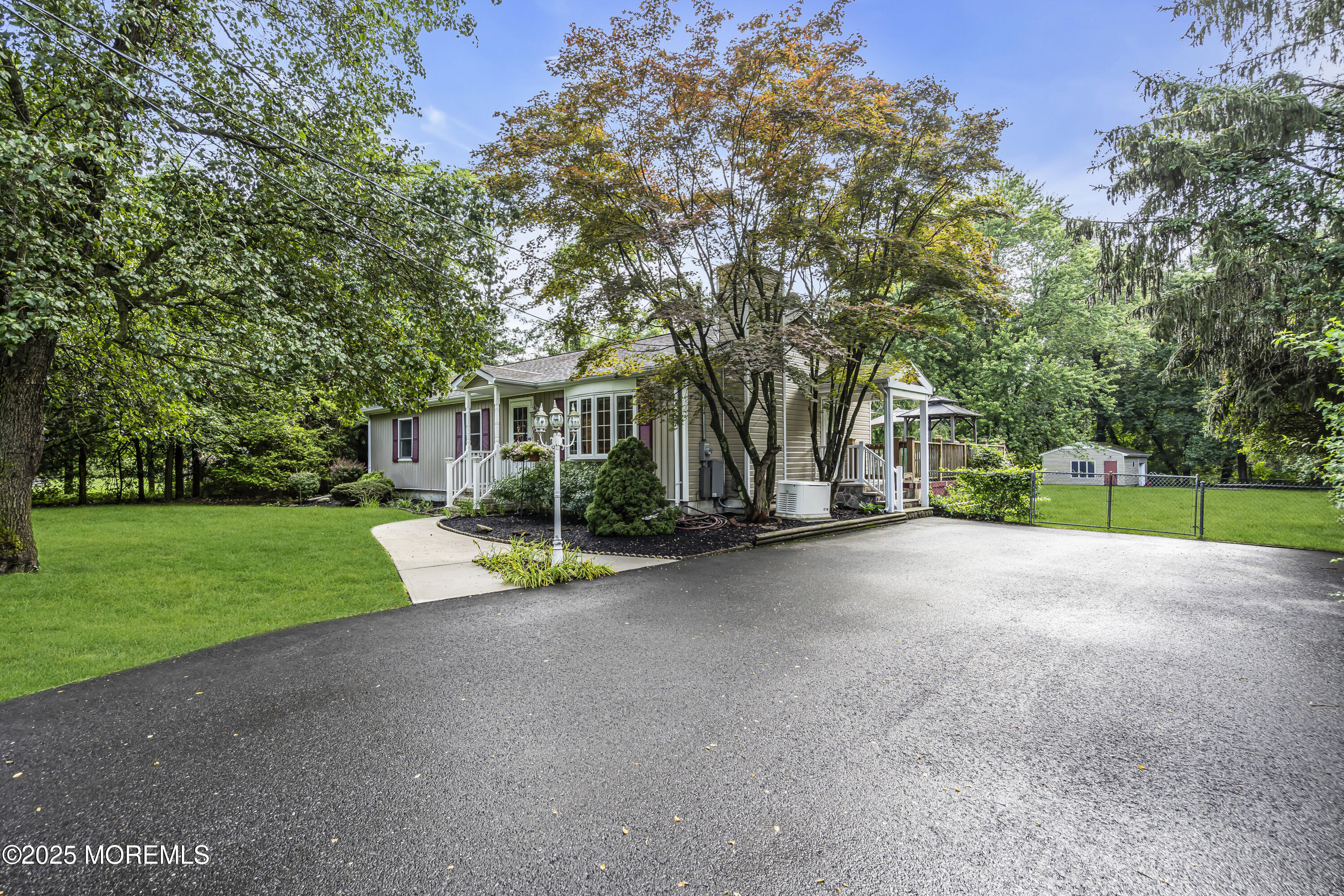 444 Cook Road Jackson, NJ 08527 - Photo 64 of 71 a view of a house with a big yard and large trees