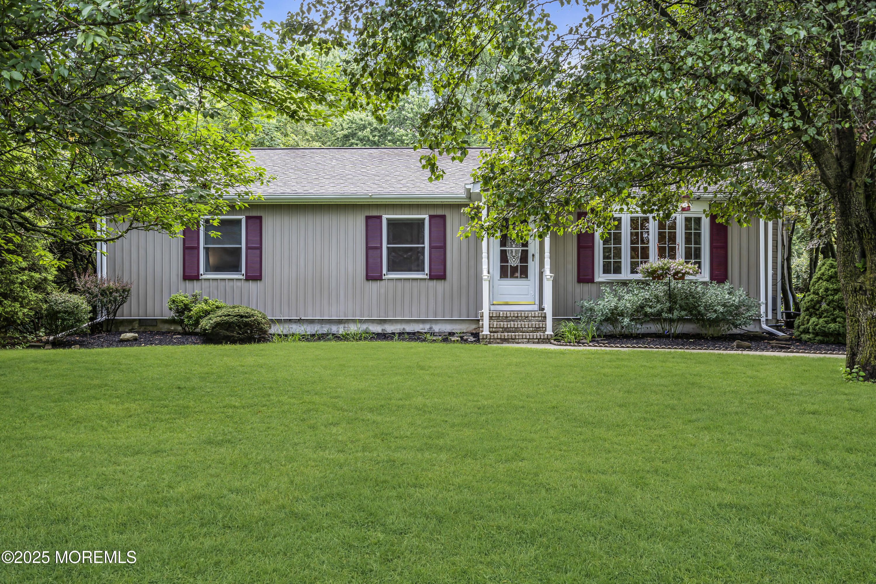 444 Cook Road Jackson, NJ 08527 - Photo 69 of 71 a front view of house with yard and green space