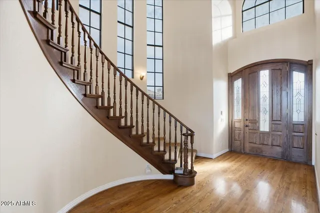 a view of an entryway with wooden floor