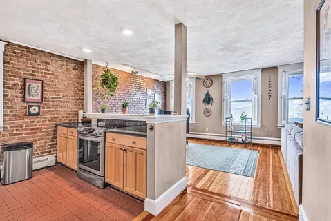 a kitchen with stainless steel appliances granite countertop a stove and a sink