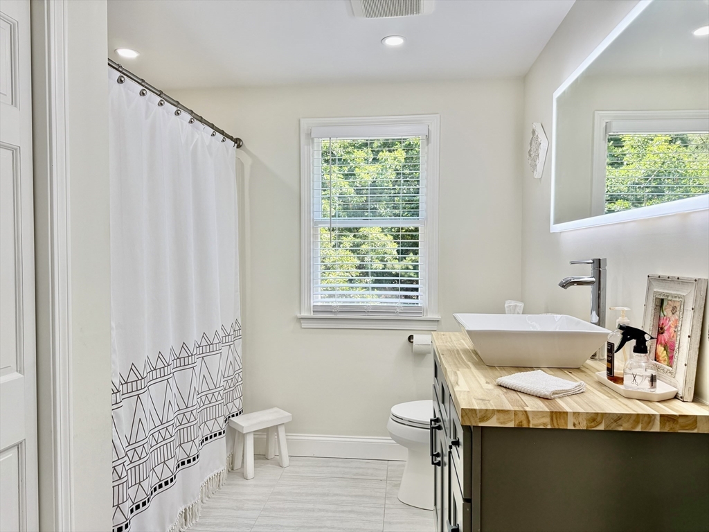 117 A P Newcomb Road Brewster, MA 02631 - Photo 24 of 42 a bathroom with a sink a toilet and tub