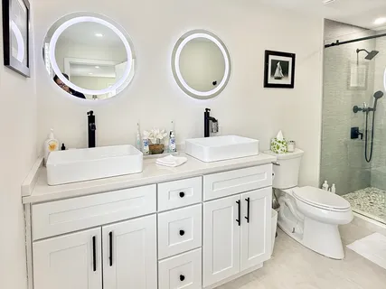 a view of a hallway with a livingroom and furniture