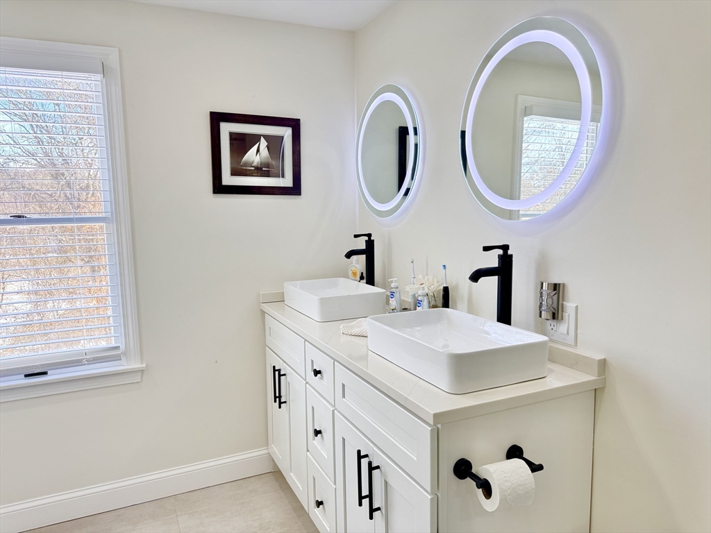 117 A P Newcomb Road Brewster, MA 02631 - Photo 32 of 42 a bathroom with a sink and a mirror