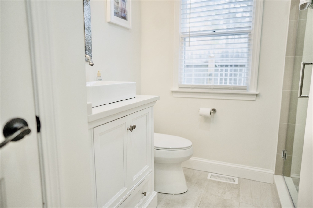 117 A P Newcomb Road Brewster, MA 02631 - Photo 34 of 42 a bathroom with a sink a toilet and a window