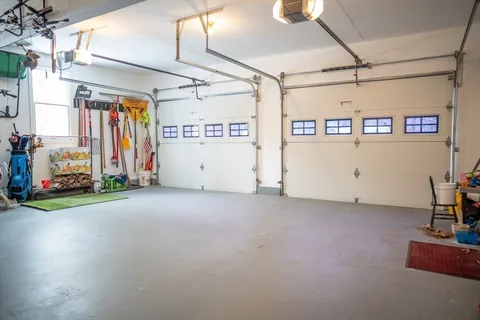 a view of a house with backyard stove and sitting area