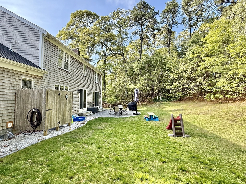 117 A P Newcomb Road Brewster, MA 02631 - Photo 41 of 42 a view of a house with backyard stove and sitting area