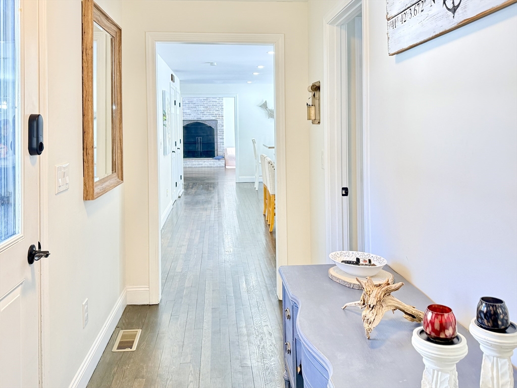 117 A P Newcomb Road Brewster, MA 02631 - Photo 8 of 42 a view of a hallway to a livingroom with furniture
