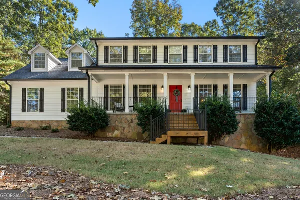 a front view of a house with garden