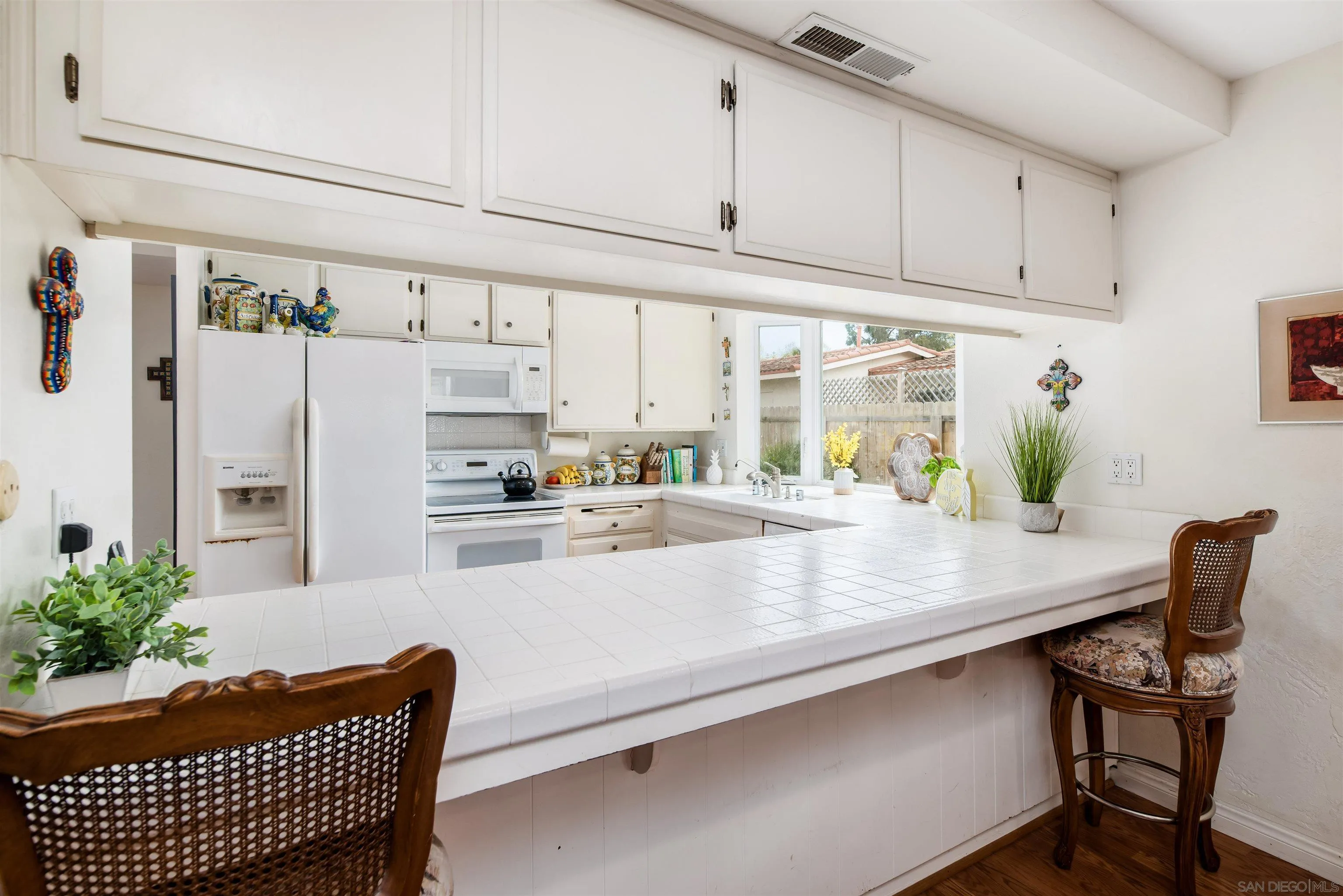 13766 Durango Drive Del Mar, CA 92014 - Photo 11 of 30 a kitchen with stainless steel appliances granite countertop a refrigerator and a sink