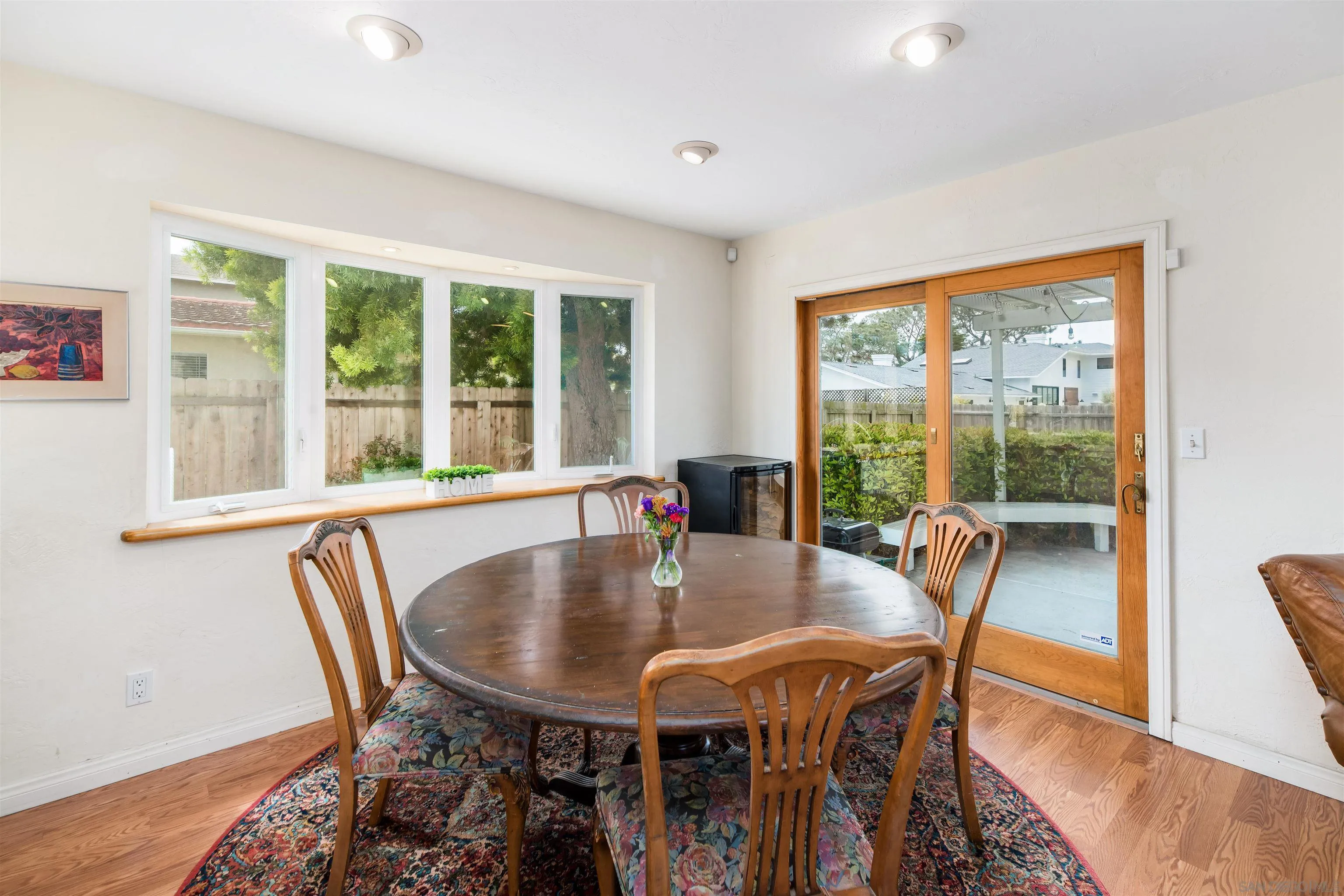 13766 Durango Drive Del Mar, CA 92014 - Photo 13 of 30 a dining room with furniture window and wooden floor