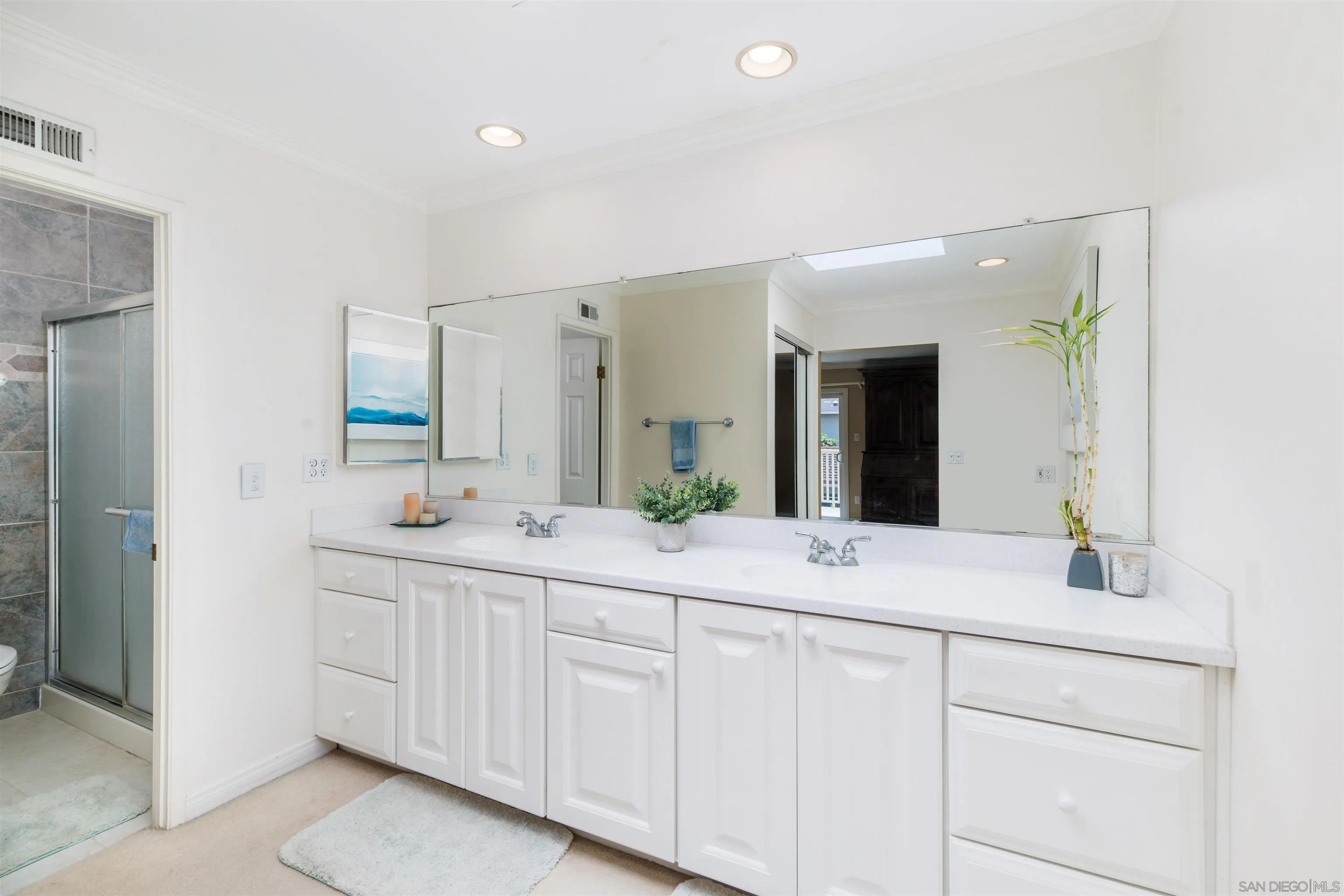 13766 Durango Drive Del Mar, CA 92014 - Photo 27 of 30 a bathroom with a sink and a mirror