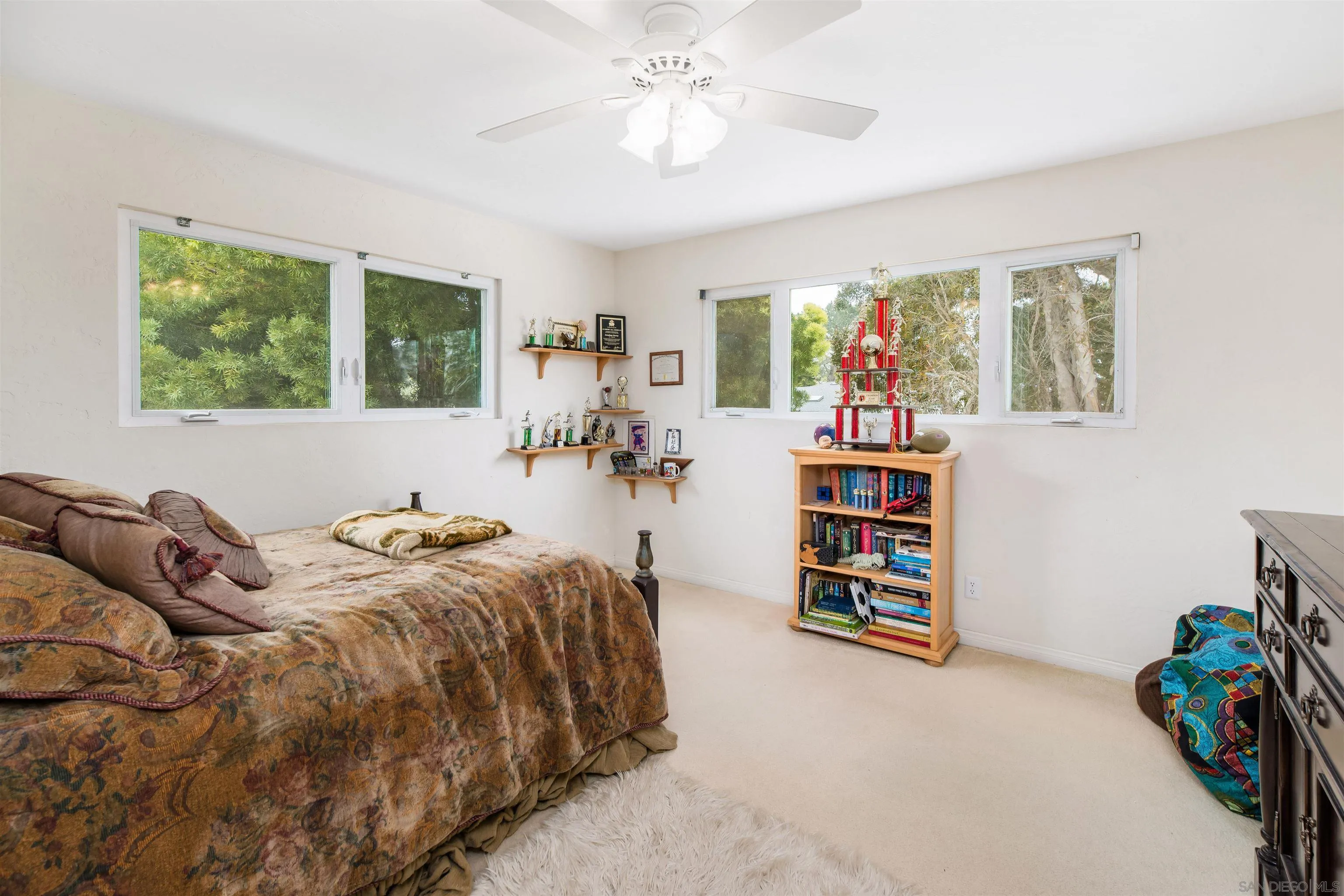 13766 Durango Drive Del Mar, CA 92014 - Photo 30 of 30 a bed room with a bed and a book shelf