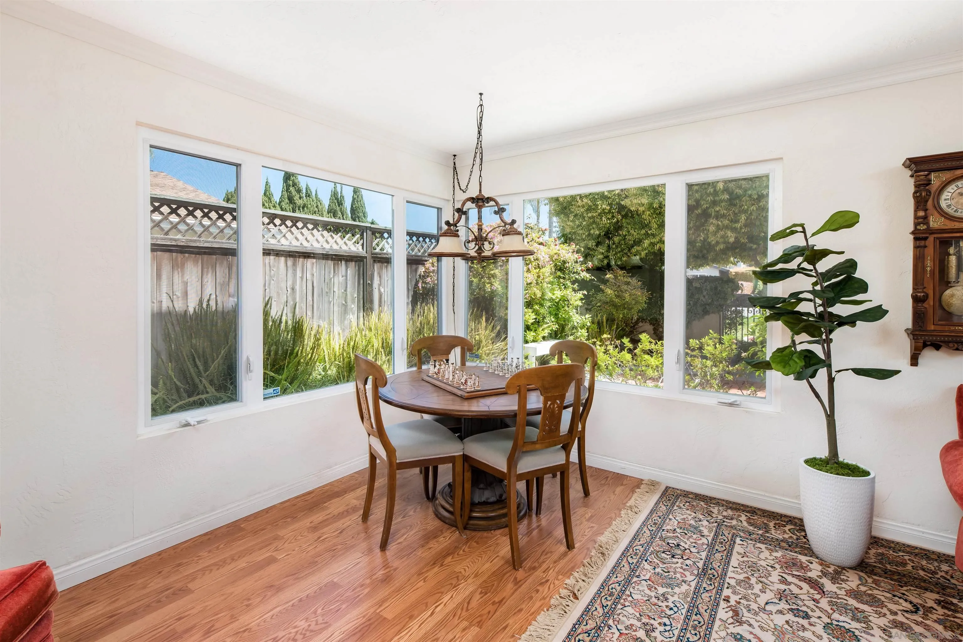 13766 Durango Drive Del Mar, CA 92014 - Photo 4 of 30 a view of a dining room with furniture window and wooden floor