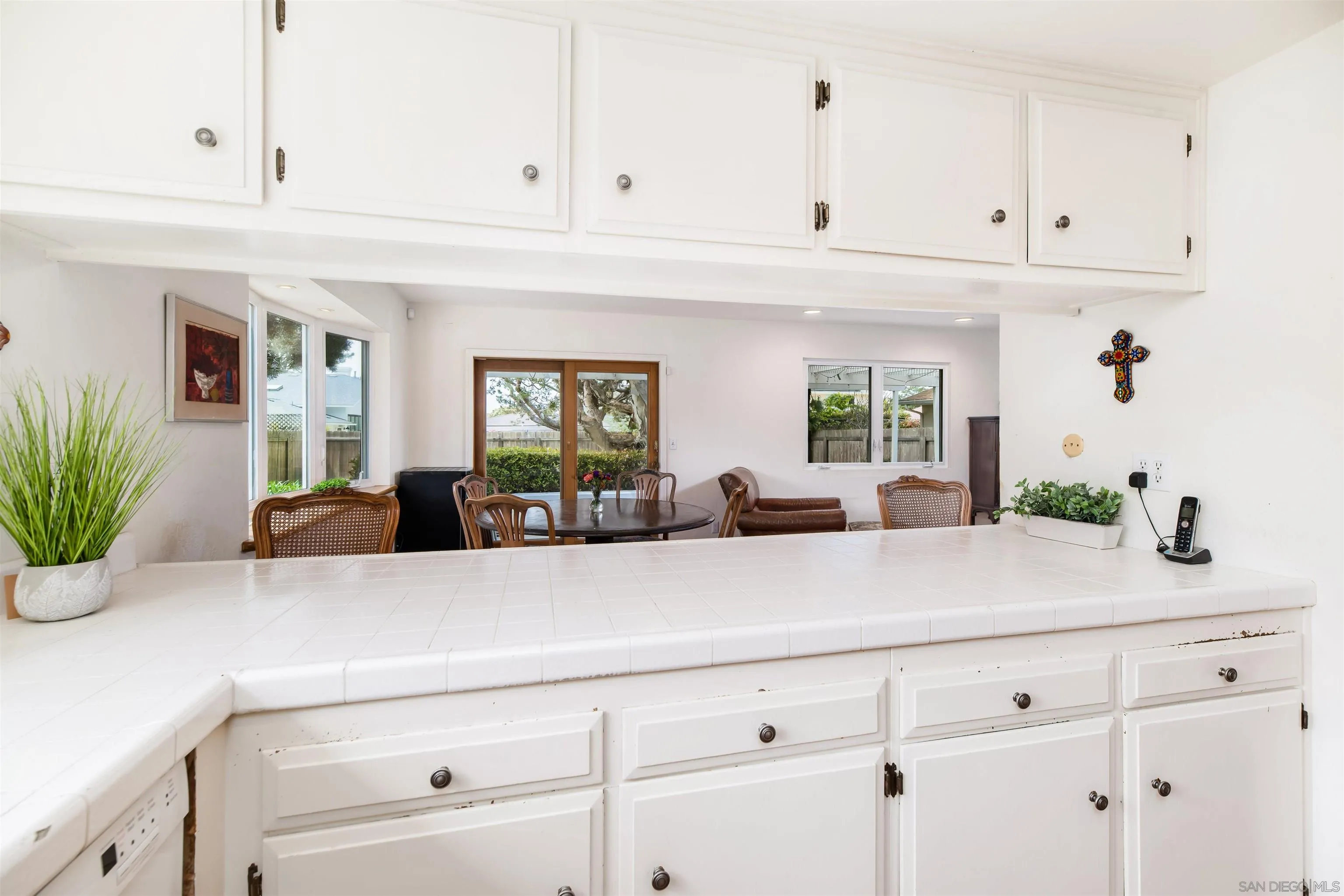 13766 Durango Drive Del Mar, CA 92014 - Photo 10 of 30 a kitchen with stainless steel appliances cabinets and a potted plant