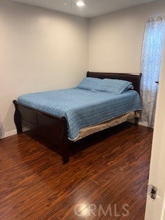 9917 Van Ruiten Street Bellflower, CA 90706 - Photo 14 of 23 a bedroom with a bed and wooden floor
