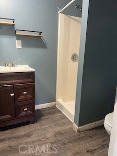 9917 Van Ruiten Street Bellflower, CA 90706 - Photo 15 of 23 a bathroom with a sink vanity and a toilet