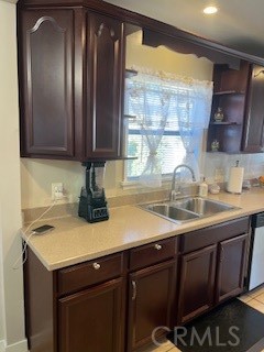 9917 Van Ruiten Street Bellflower, CA 90706 - Photo 8 of 23 a kitchen with a sink a window and cabinets