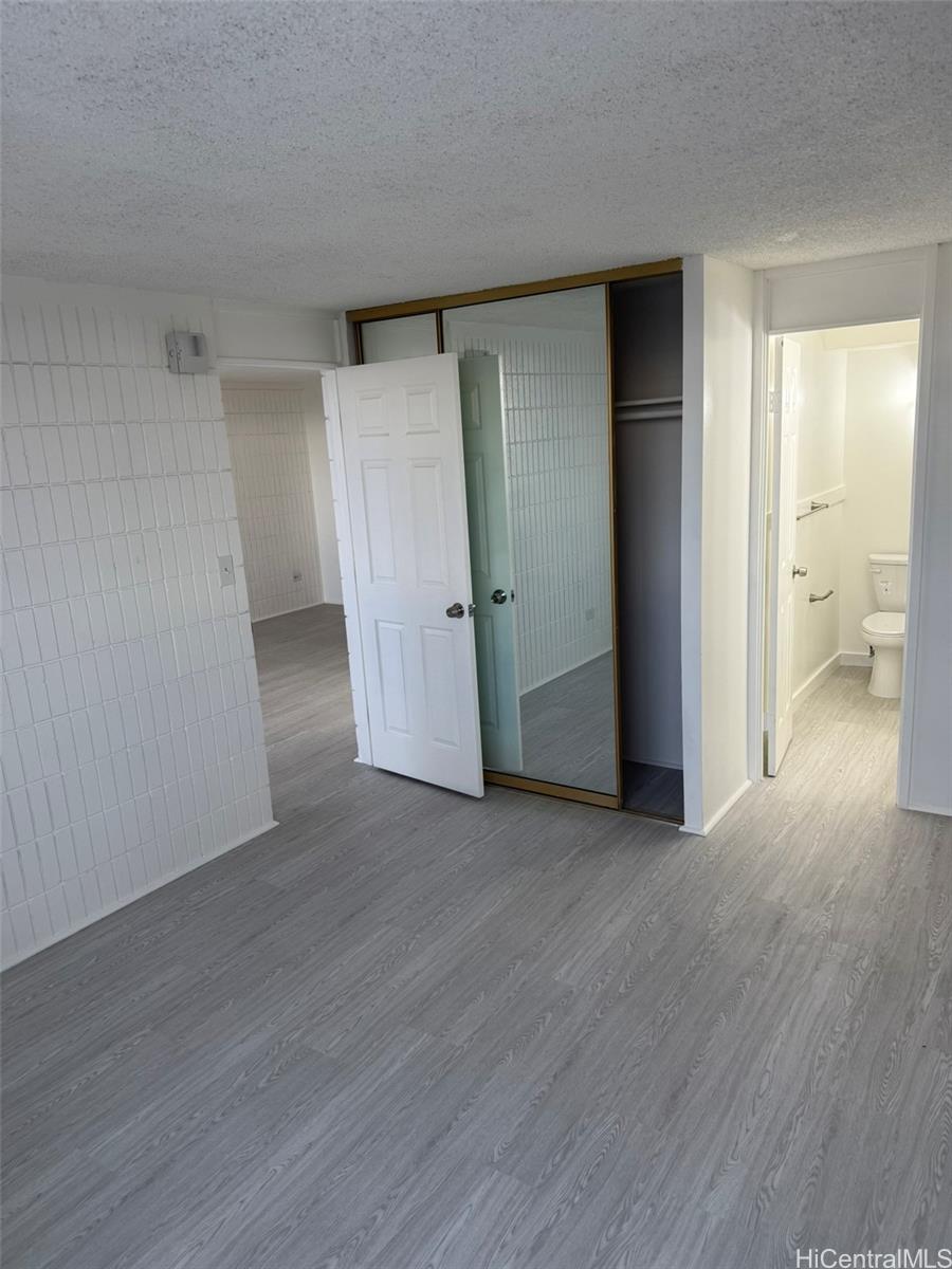 3215 Ala Ilima Street, Unit A1202 Honolulu, HI 96818 - Photo 13 of 20 a view of empty room with wooden floor