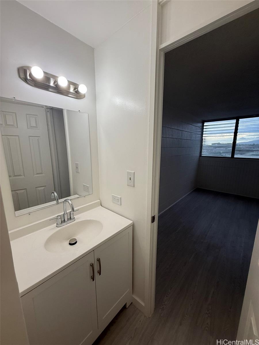 3215 Ala Ilima Street, Unit A1202 Honolulu, HI 96818 - Photo 16 of 20 a bathroom with a sink and a mirror