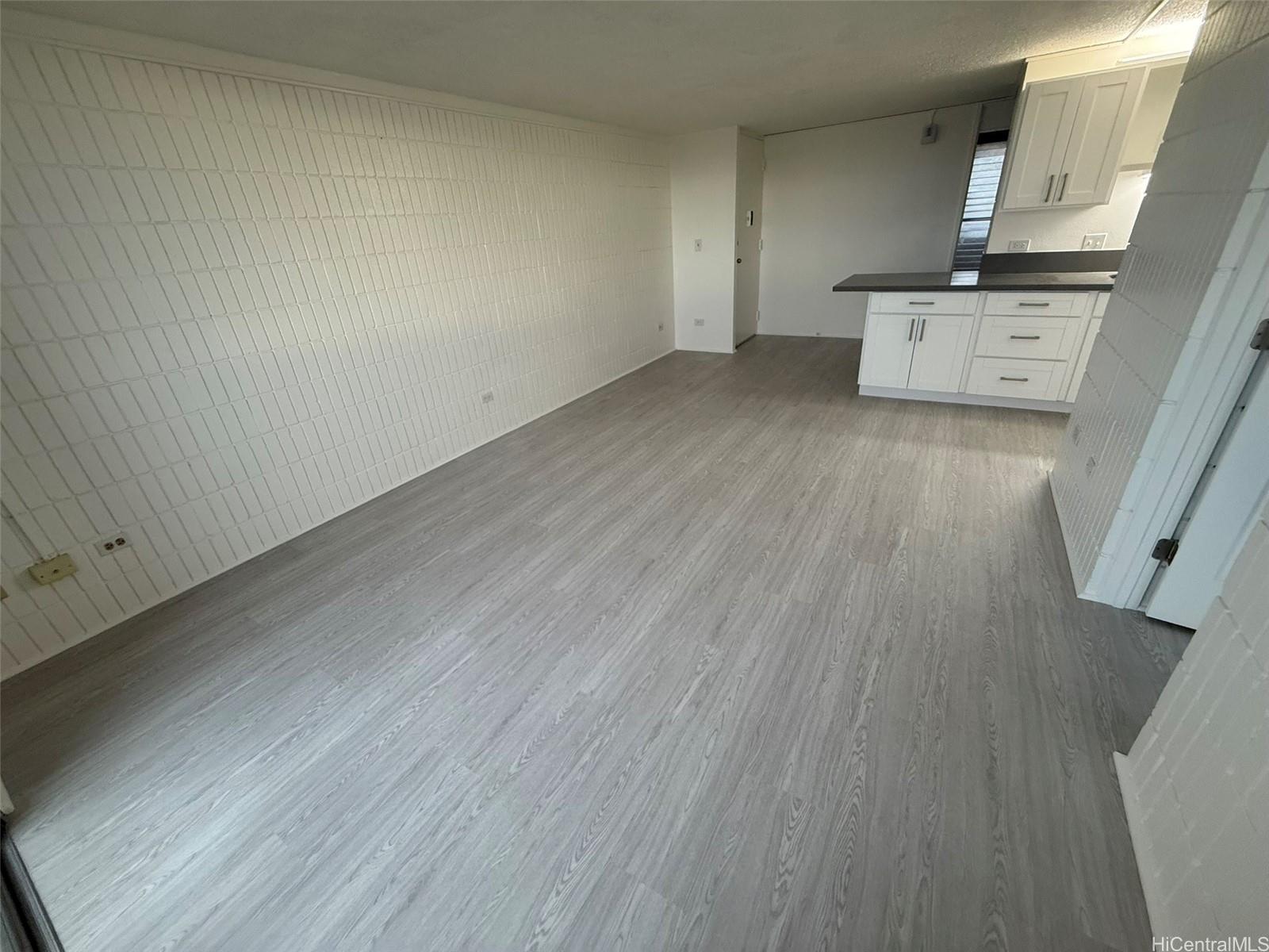 3215 Ala Ilima Street, Unit A1202 Honolulu, HI 96818 - Photo 18 of 20 wooden floor in a kitchen